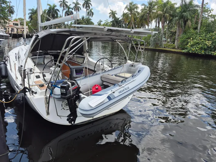 Wanderer Yacht Photos Pics 2019 Beneteau Oceanis 41.1 sailboat docked by a tropical canal with inflatable dinghy.