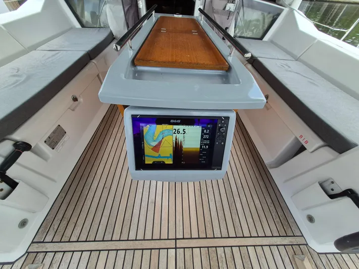 Wanderer Yacht Photos Pics 2019 Beneteau Oceanis 41.1 cockpit with navigation display and teak flooring.