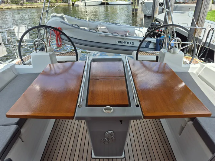 Wanderer Yacht Photos Pics Cockpit of 2019 Beneteau Oceanis 41.1 with wooden table and dual steering wheels.