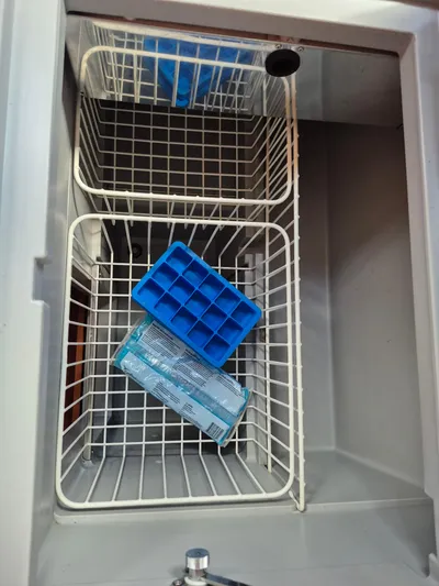 Wanderer Yacht Photos Pics Ice maker with blue ice trays inside a Beneteau Oceanis 41.1 yacht, 2019 model.