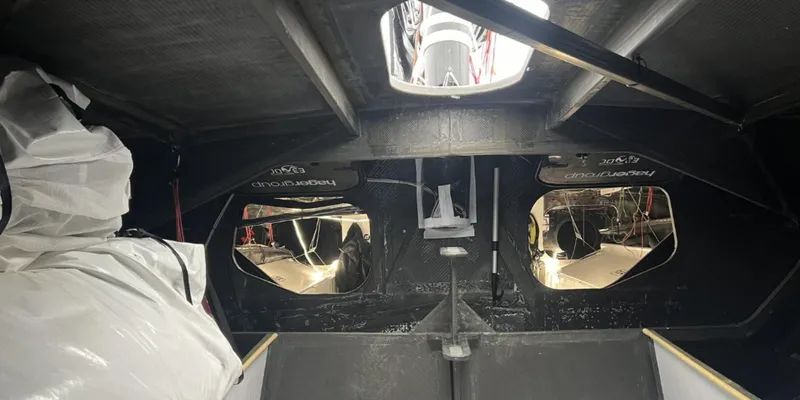 Ocean Calling Yacht Photos Pics Interior of 2007 Hake/Seaward Open 60 sailboat, showing cabin details and storage.