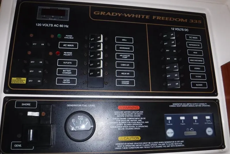  Yacht Photos Pics Control panel of a 2014 Grady-White Freedom 335 boat, showing electrical switches and gauges.