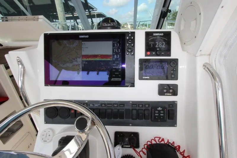 No Name Yacht Photos Pics Control panel of 2015 True World Marine TE 289 boat with navigation and monitoring systems.
