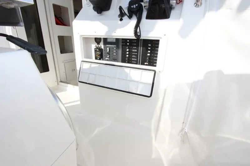 No Name Yacht Photos Pics Control panel of a 2015 True World Marine TE 289 boat, featuring switches and equipment.