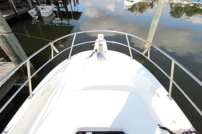 No Name Yacht Photos Pics Bow view of 2015 True World Marine TE 289 boat docked in calm waters.