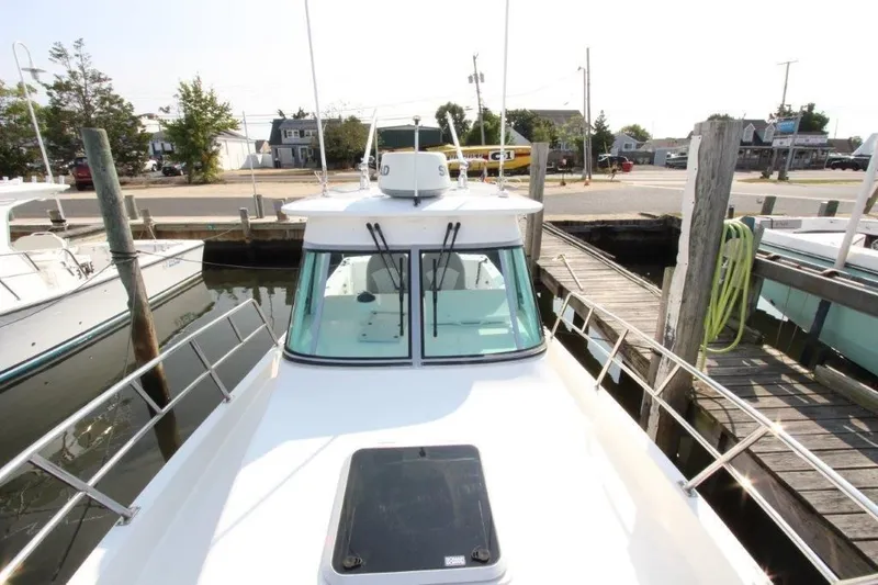 No Name Yacht Photos Pics 2015 True World Marine TE 289 boat docked at a marina, front view.