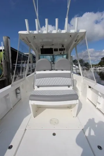 No Name Yacht Photos Pics 2015 True World Marine TE 289 boat interior with seating and rod holders.