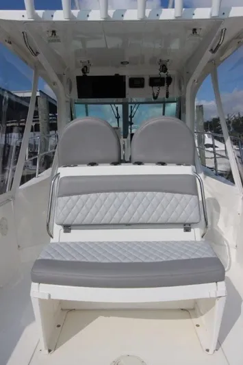 No Name Yacht Photos Pics 2015 True World Marine TE 289 boat interior with dual gray seats and white cabin.