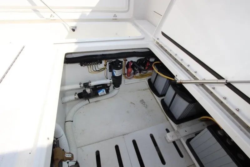 No Name Yacht Photos Pics 2015 True World Marine TE 289 boat compartment with batteries and wiring.
