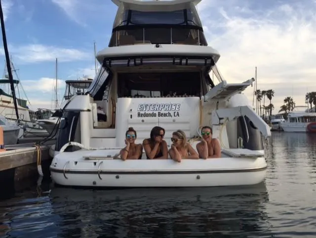 The Enterprise Yacht Photos Pics Four people relaxing on a Sunseeker MANHATTAN yacht, Redondo Beach marina, 1995 model.