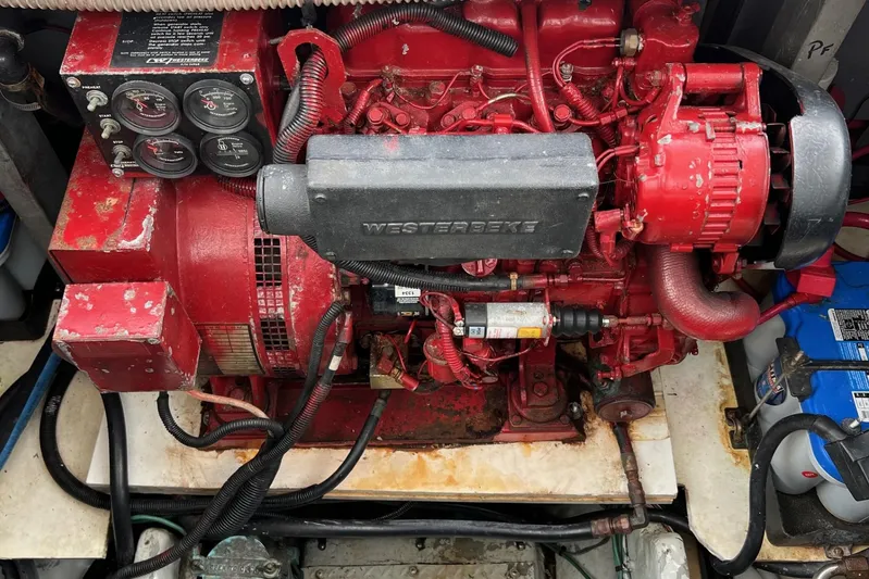  Yacht Photos Pics Engine compartment of a 2000 Sea Ray 400 Sedan Bridge with red Westerbeke generator.