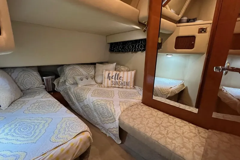  Yacht Photos Pics 2000 Sea Ray 400 Sedan Bridge cabin with cozy twin beds and decorative pillows.