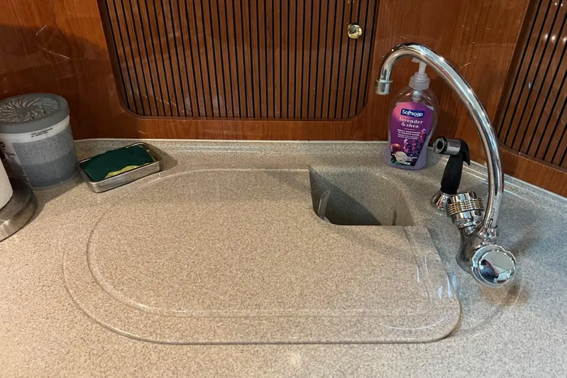  Yacht Photos Pics Kitchen sink area on a 2000 Sea Ray 400 Sedan Bridge yacht.