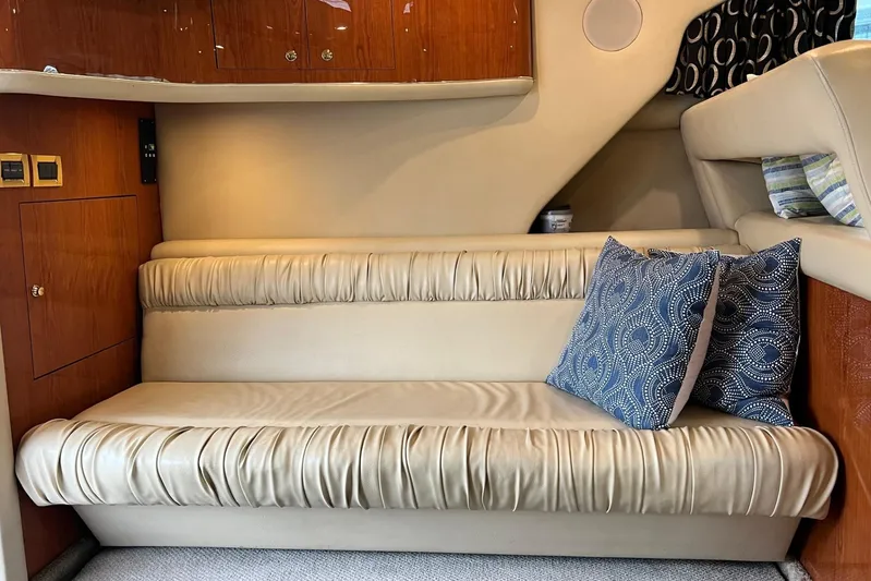  Yacht Photos Pics Luxurious interior of 2000 Sea Ray 400 Sedan Bridge with plush seating and decorative pillows.