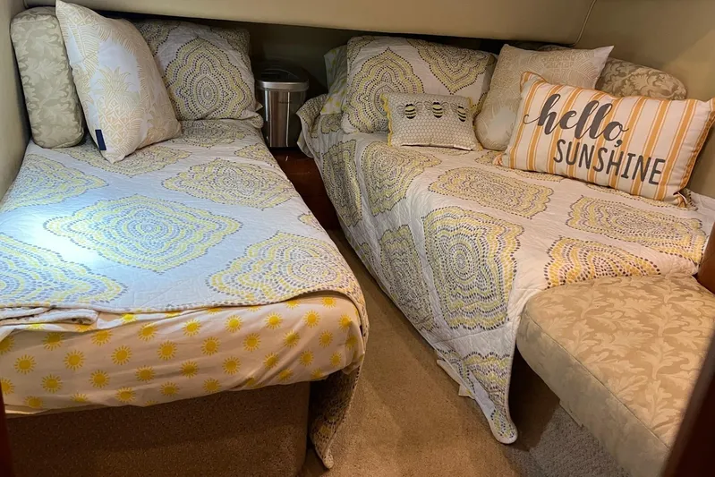  Yacht Photos Pics Cozy twin beds in 2000 Sea Ray 400 Sedan Bridge cabin with decorative pillows.