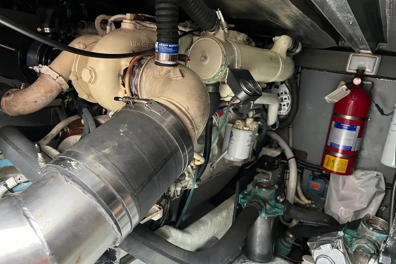  Yacht Photos Pics Engine room of a 2000 Sea Ray 400 Sedan Bridge with visible components and fire extinguisher.