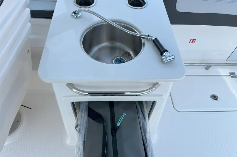  Yacht Photos Pics 2026 Robalo R257 Dual Console boat sink with storage compartment.