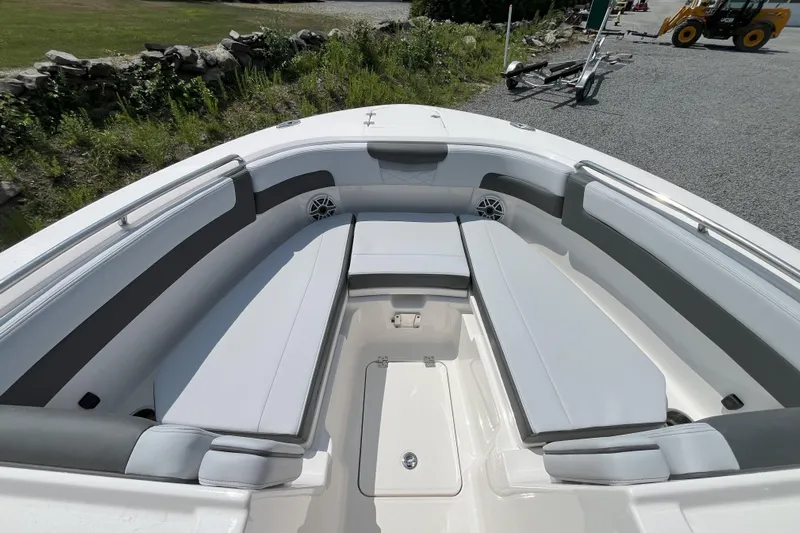  Yacht Photos Pics 2026 Robalo R257 Dual Console boat interior with cushioned seating and storage.
