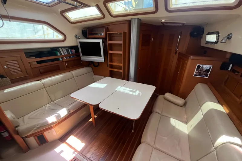 Ruby Lee Yacht Photos Pics Luxurious 2006 Island Packet 445 yacht interior with spacious seating and elegant wood finishes.