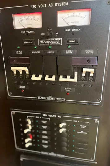 Ruby Lee Yacht Photos Pics Electrical panel of 2006 Island Packet 445 yacht, showing 120-volt AC system controls.