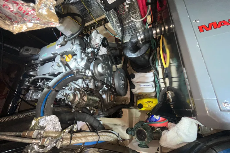 Ruby Lee Yacht Photos Pics Engine room of a 2006 Island Packet 445 sailboat, showcasing mechanical components and wiring.