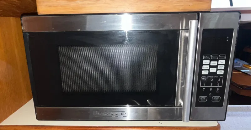 Ruby Lee Yacht Photos Pics Stainless steel microwave oven inside a 2006 Island Packet 445 yacht kitchen.