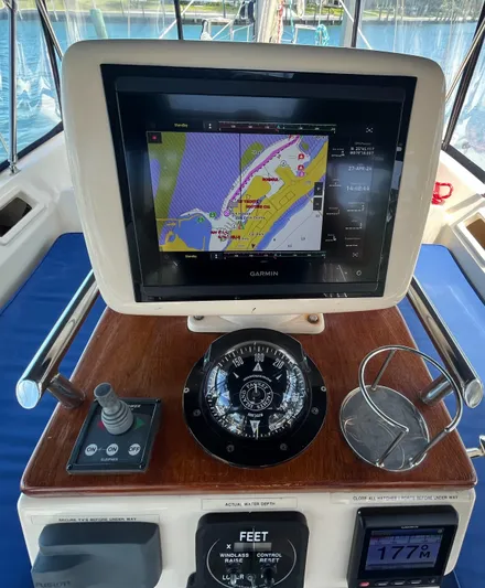 Ruby Lee Yacht Photos Pics Navigation system on 2006 Island Packet 445 sailboat, featuring Garmin display and compass.