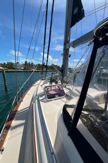 Ruby Lee Yacht Photos Pics 2006 Island Packet 445 sailboat deck with clear skies and marina view.