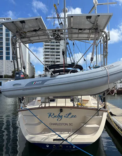 Ruby Lee Yacht Photos Pics Island Packet 445 sailboat, 2006 model, docked with dinghy and solar panels, Charleston, SC.