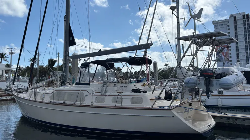 Ruby Lee Yacht Photos Pics 2006 Island Packet 445 sailboat docked at marina under blue sky.
