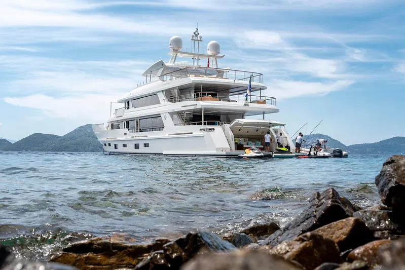 Sunrise Yacht Photos Pics Luxurious 2019 Yildiz 141 yacht anchored in scenic coastal waters.