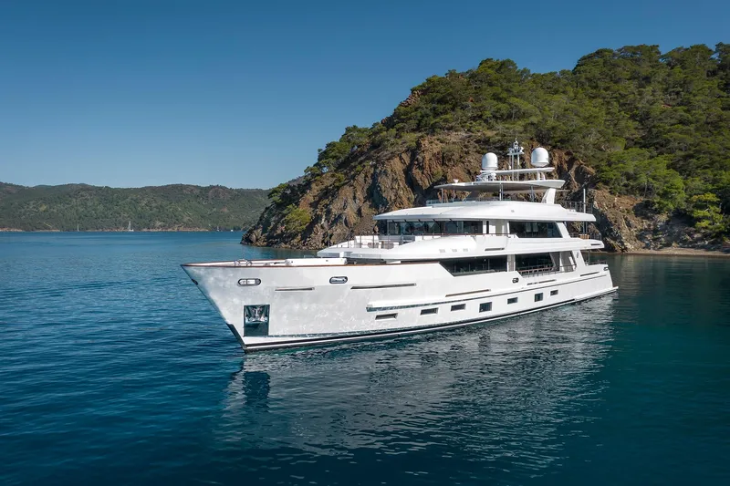 Sunrise Yacht Photos Pics Luxurious 2019 Yildiz 141 yacht cruising near scenic rocky coastline.