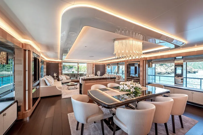 Sunrise Yacht Photos Pics Luxurious interior of 2019 Yildiz 141 yacht with elegant dining area and scenic ocean views.