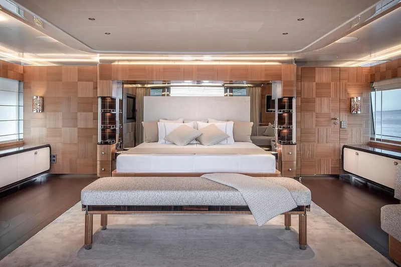 Sunrise Yacht Photos Pics Luxurious Yildiz 141 yacht bedroom interior, featuring elegant wood paneling and modern design, 2019 model.