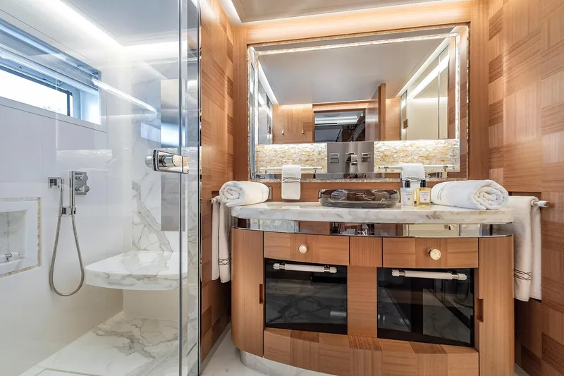 Sunrise Yacht Photos Pics Luxurious yacht bathroom with marble shower and elegant wooden vanity, Yildiz 141, 2019 model.