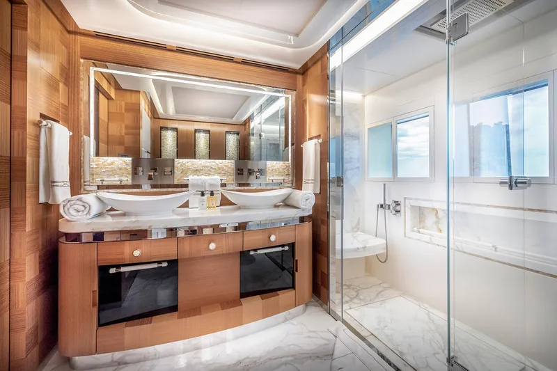 Sunrise Yacht Photos Pics Luxurious Yildiz 141 yacht bathroom, 2019 model, featuring elegant wood and marble finishes.