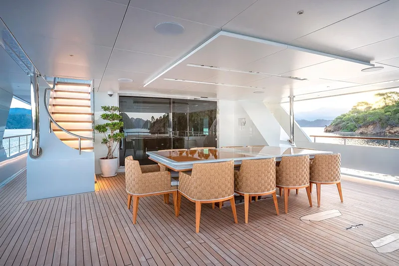 Sunrise Yacht Photos Pics Luxurious Yildiz 141 yacht deck with elegant dining area, scenic ocean view, 2019 model.