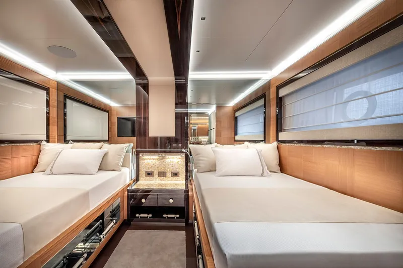 Sunrise Yacht Photos Pics Luxurious 2019 Yildiz 141 yacht interior with twin beds and elegant wood paneling.