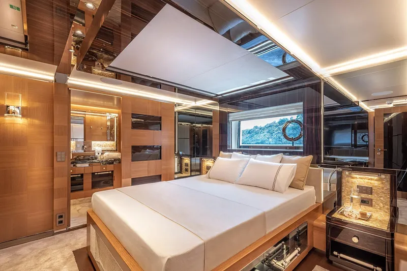 Sunrise Yacht Photos Pics Luxurious Yildiz 141 yacht bedroom interior, featuring elegant wood paneling and modern lighting, 2019 model.