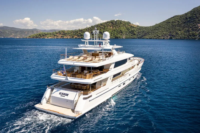 Sunrise Yacht Photos Pics Luxurious 2019 Yildiz 141 yacht cruising in clear blue waters near scenic coastline.