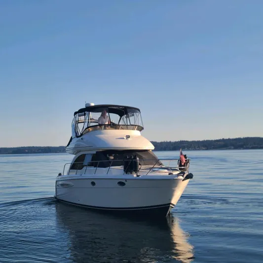 New Lease On Life Yacht Photos Pics 2004 Meridian 341 yacht cruising on calm waters under clear blue sky.