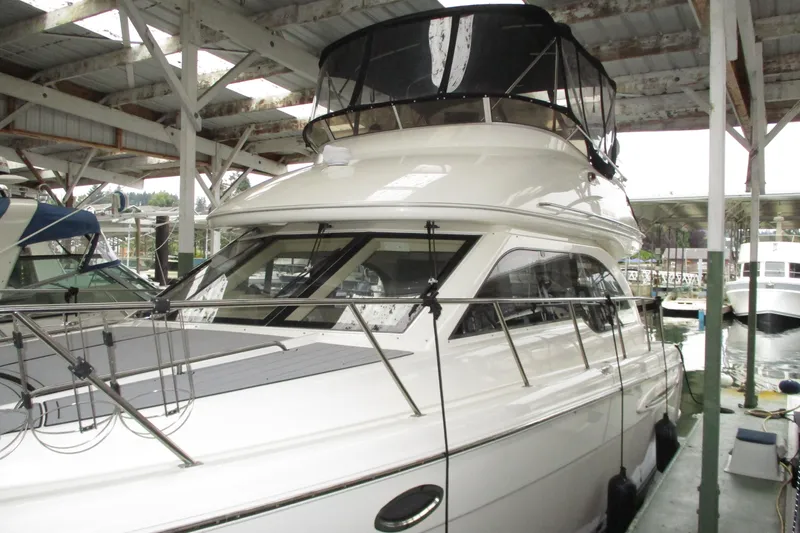 New Lease On Life Yacht Photos Pics 2004 Meridian 340 yacht docked in a covered marina.