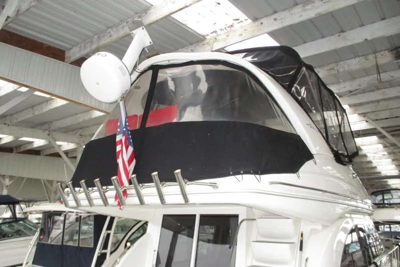 New Lease On Life Yacht Photos Pics 2004 Meridian 340 yacht with radar and American flag in covered marina.