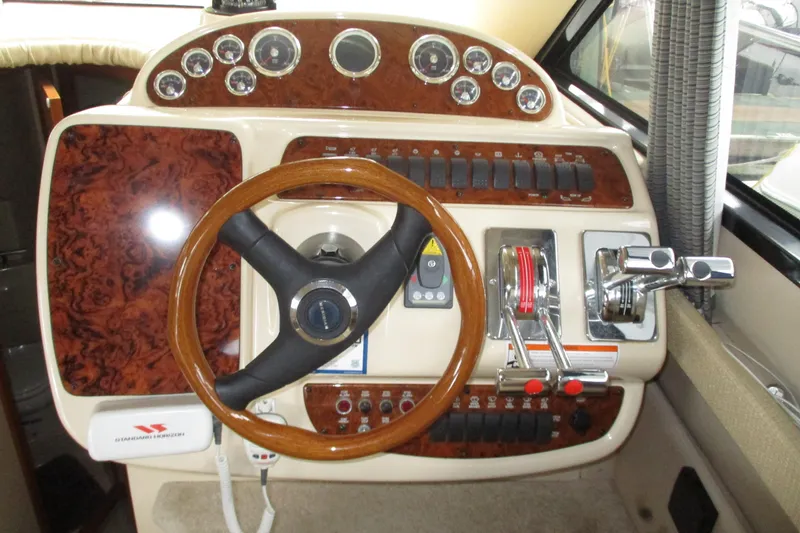 New Lease On Life Yacht Photos Pics 2004 Meridian 340 helm with wood accents and control panel.