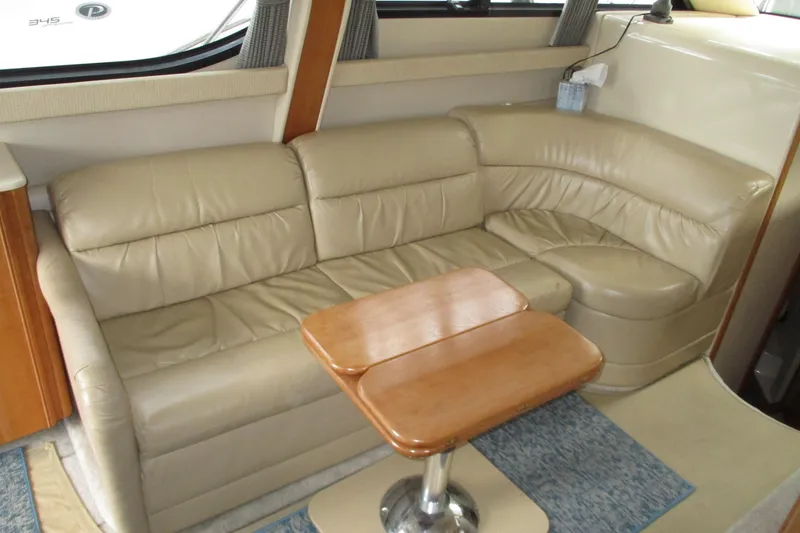 New Lease On Life Yacht Photos Pics Luxurious beige leather seating in 2004 Meridian 340 yacht interior.