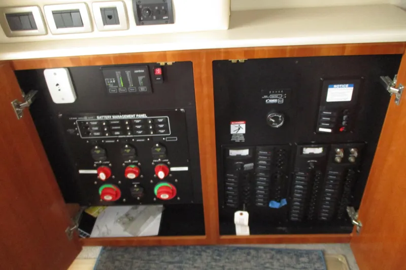 New Lease On Life Yacht Photos Pics Electrical control panel inside a 2004 Meridian 340 boat, featuring battery management and switches.