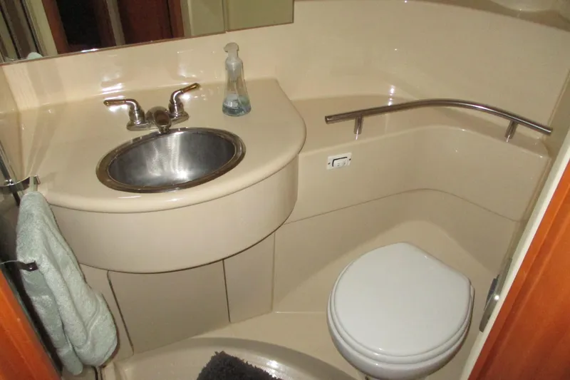 New Lease On Life Yacht Photos Pics Bathroom interior of 2004 Meridian 340 yacht with sink and toilet.