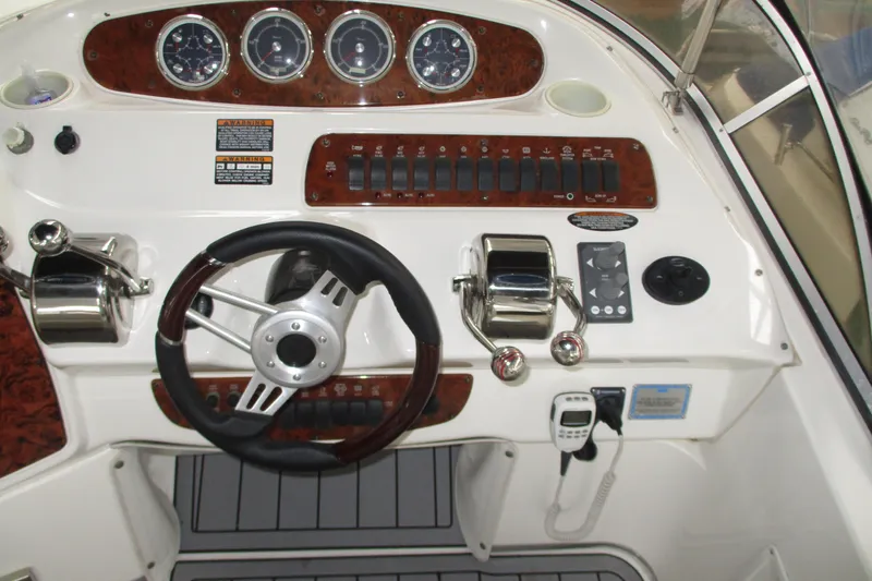 New Lease On Life Yacht Photos Pics 2004 Meridian 340 boat dashboard with steering wheel and control panel.