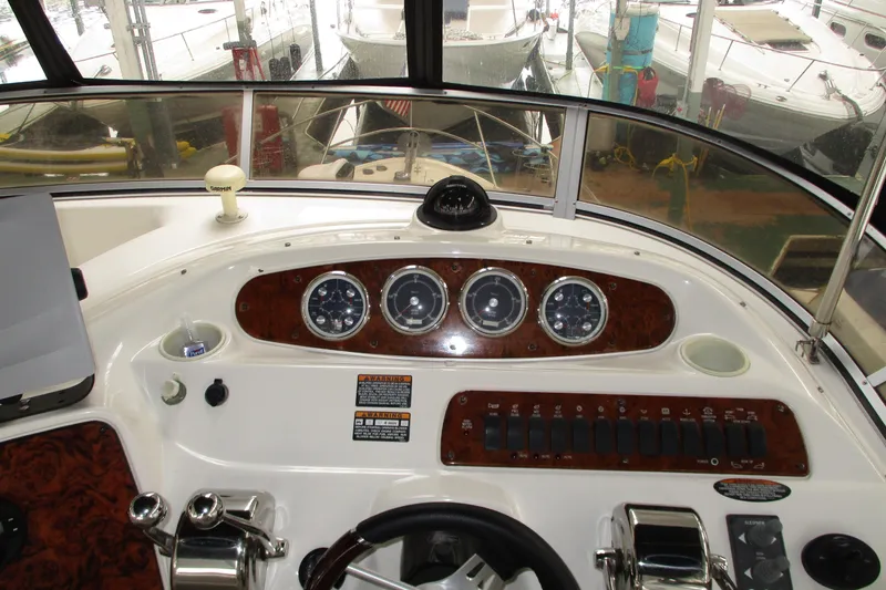 New Lease On Life Yacht Photos Pics Helm of 2004 Meridian 340 yacht with gauges and controls, docked in marina.