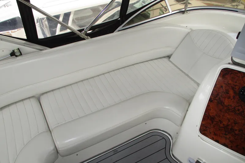 New Lease On Life Yacht Photos Pics Luxurious white seating on 2004 Meridian 340 yacht interior.